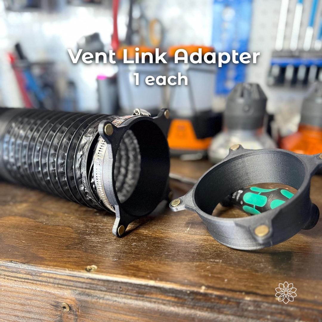 Vent Link adapter attached to flexible diesel heater ducting with metal hose clamp, showing secure connection for routing heated air into a tent, black composite adapter mounted to duct hose for controlled airflow and cleaner heater setup.