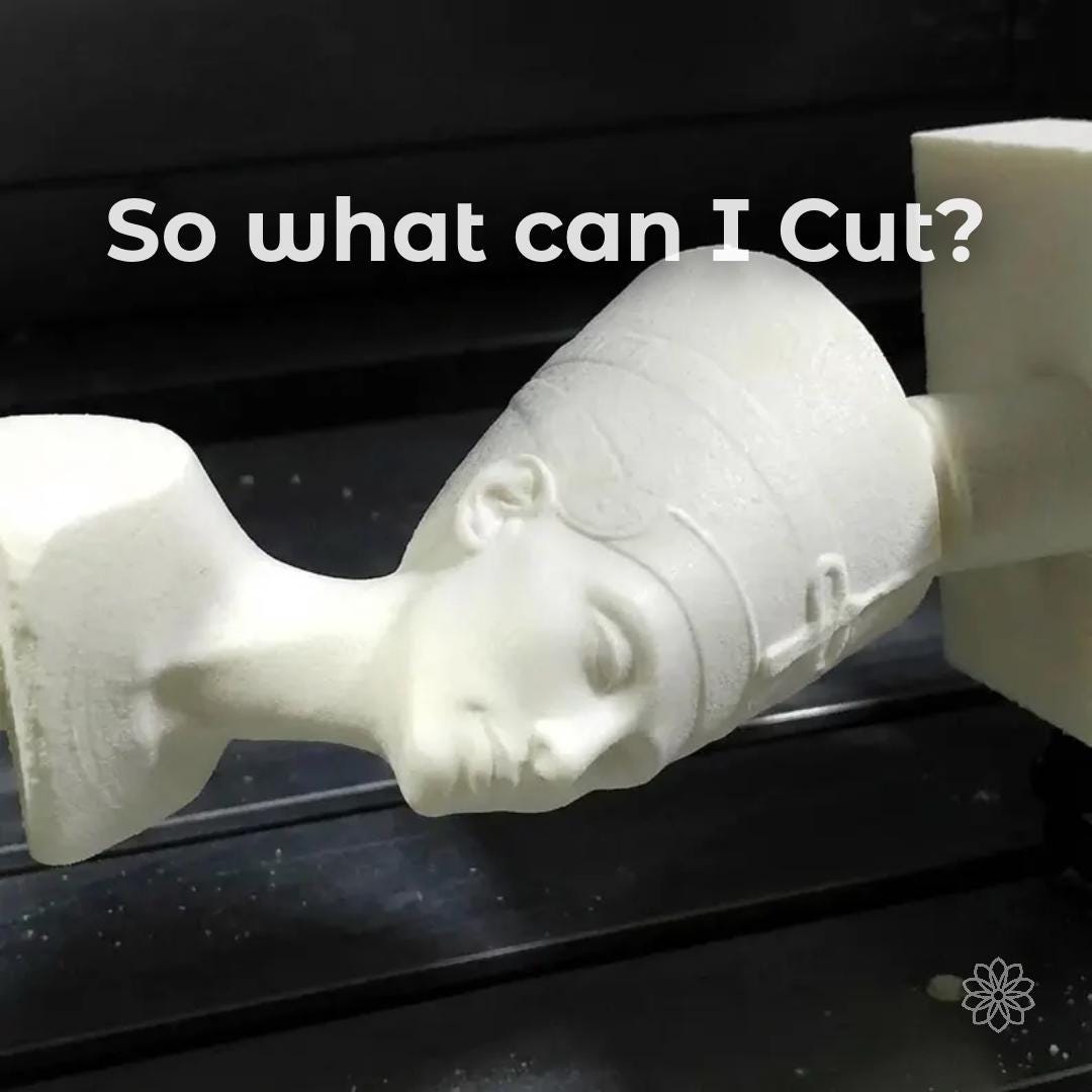 CNC machining example showing a detailed 3D sculpted bust held between fixtures, demonstrating the ability to machine complex organic geometry. Overlay text reads “So what can I cut?” highlighting capability beyond flat parts. Smooth surface transitions and preserved facial detail show precision carving for artistic models, prototypes, and custom sculptural components.