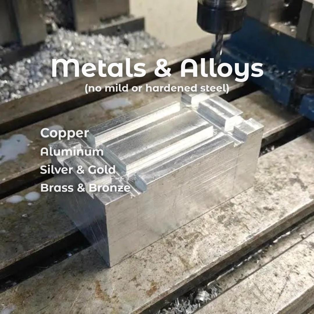 CNC milling aluminum block inside machine with visible toolpaths and clean step-down passes. Overlay text reads “metals & alloys (no mild or hardened steel)” with supported materials including copper, aluminum, silver, gold, brass, and bronze. Image demonstrates rigid machining setup and precision cutting for custom metal parts, engraved components, and small batch production.
