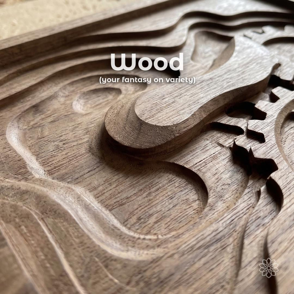 Close-up of CNC carved wood panel showing layered toolpaths, smooth contours, and clean edge definition. Overlay text reads “Wood (your fantasy on variety).” Natural grain detail and stepped machining passes highlight ability to produce decorative carvings, signage, and custom wooden components with precise depth control.