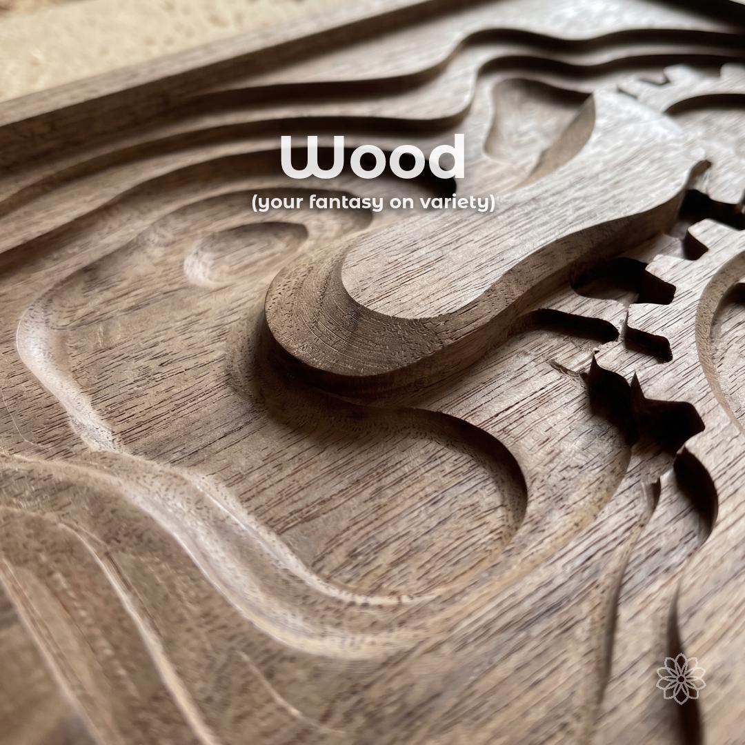 Close-up of a carved wood relief with flowing contours and cut-through details, showing custom CNC woodworking for hardwood projects, relief carving, decorative panels, signs, inlays, bespoke wood commissions, and specialty wood designs made from customer ideas.