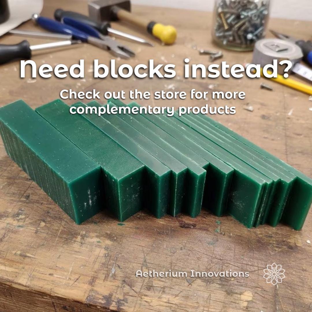 Multiple green jewelry carving wax blocks arranged on a jeweler’s workbench with hand tools in the background. Text reads “need blocks instead? Check out the store for more complementary products.” Aetherium Innovations branding visible. Jewelry carving wax blocks for lost wax casting, signet carving, wax modeling, and jewelry fabrication supplies.