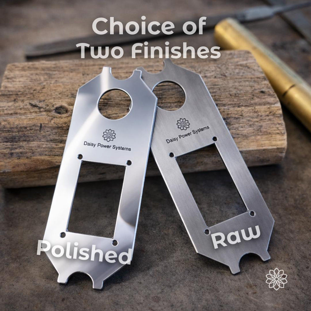 Text reads “Choice of Two Finishes,” with labels “Polished” and “Raw.” Two aluminum Daisy Power Systems faceplates are shown side by side on a wood block. The polished option has a brighter reflective surface, while the raw option has a brushed machined look for a more utilitarian Super Pacific X1 camper interior.