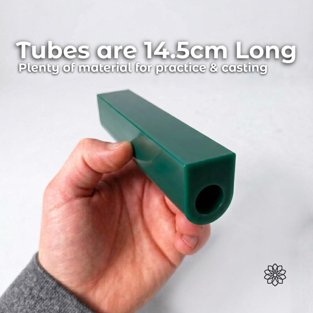 Hand holding a large green jewelry carving wax ring tube against a clean white background. Text reads “Tubes are 14.5cm Long Plenty of material for practice & casting.” Image demonstrates the size and usable carving mass of the wax tube for ring carving, jewelry fabrication, signet carving, and lost wax casting workflows.