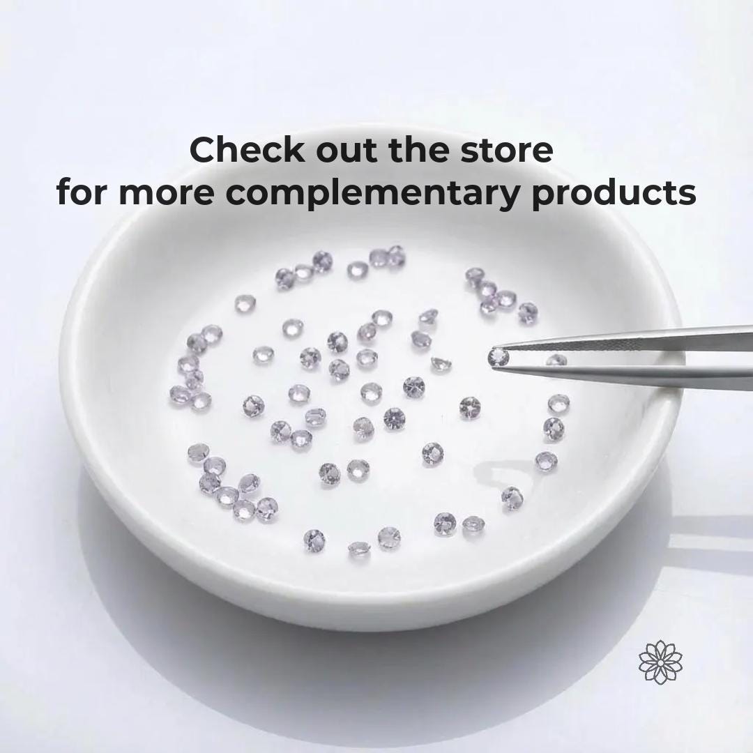 Calibrated round alexandrite gemstones arranged inside a white ceramic dish, with metal tweezers holding a single stone at the edge. Stones appear pale and near colorless under neutral lighting, demonstrating subtle color shift behavior. Clean studio setup highlights small size, precision cutting, and suitability for jewelry making and custom stone selection.