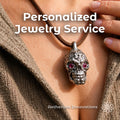 Fantasy-inspired custom skull pendant with red gemstone eyes worn on a leather cord necklace. Close-up lifestyle image showing handcrafted jewelry on a model with text promoting custom pendants, rings, and relics. Aetherium Innovations custom fantasy jewelry service focused on creating unique heirloom-quality pieces from original ideas and artwork.