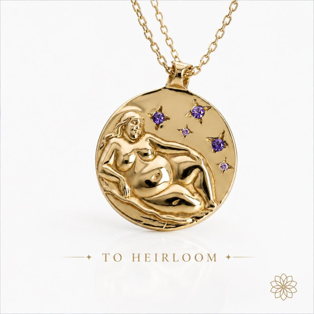 Finished custom gold pendant featuring celestial artwork, purple gemstones, and handcrafted relief sculpture suspended from a gold chain. Statement jewelry image representing the final heirloom stage of a custom jewelry project, showcasing artisan craftsmanship, gemstone setting, and personalized design work.