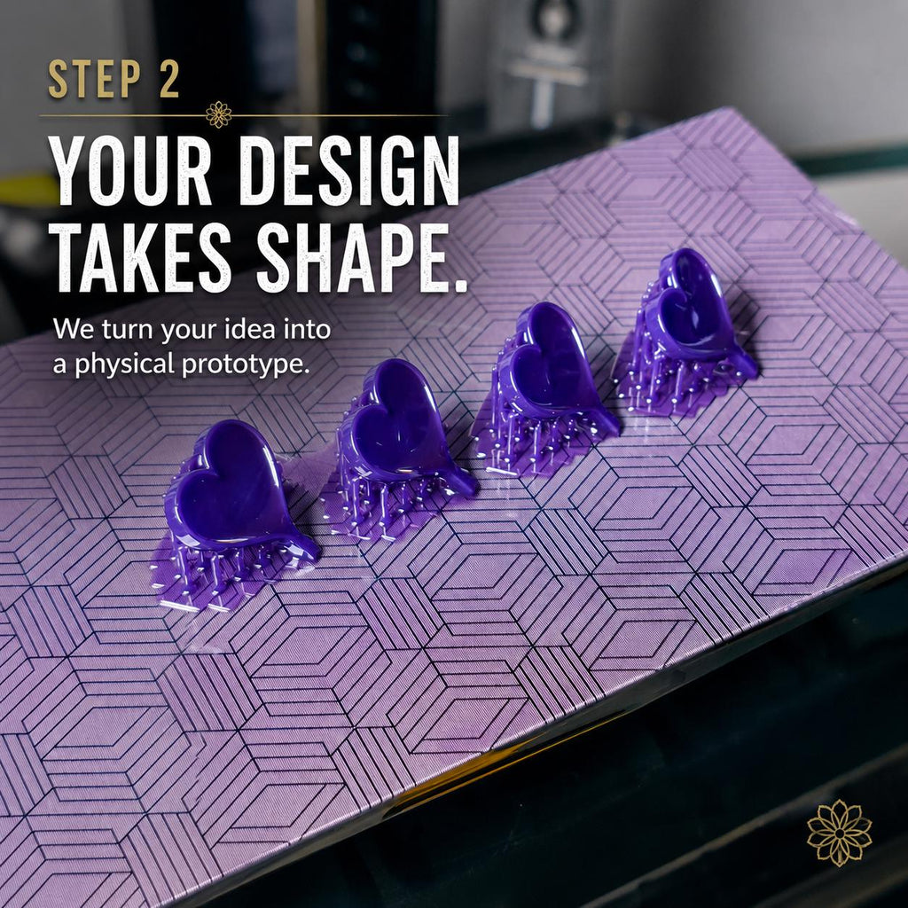 Purple resin jewelry prototypes on a 3D printer build plate demonstrating custom jewelry development and rapid prototyping