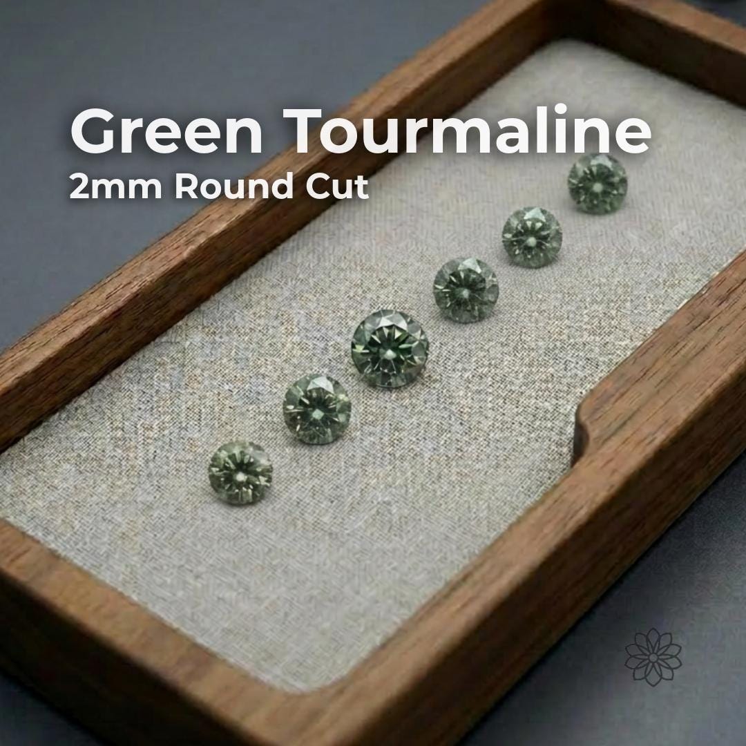 round cut lab-grown green tourmaline stones arranged on a soft neutral surface. The gemstones show rich green color with clean clarity and bright facet reflections. Overlay text reads “Green Tourmaline 2mm Round Cut.” Stones appear calibrated and consistent for jewelry making, pavé work, and accent stone settings, with Aetherium branding in the corner.