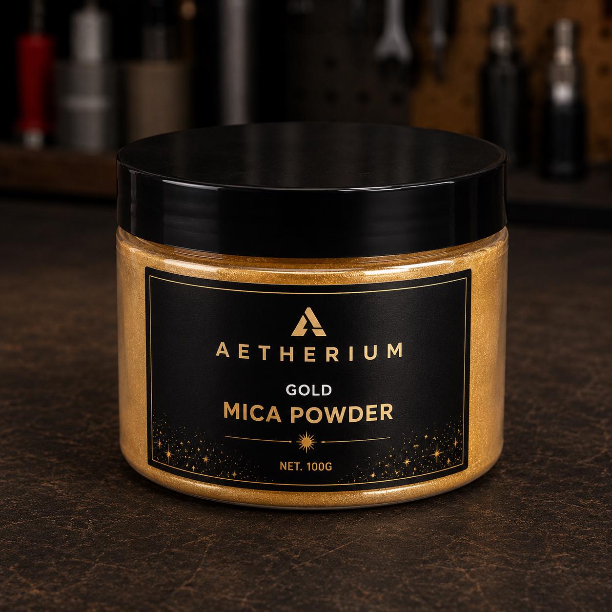 Aetherium Gold Mica Powder pigment in a 100 gram container. Fine metallic pigment powder designed for resin art, Kintsugi repair, jewelry making, decorative casting, epoxy projects, gold inlays, mixed media artwork, and creative applications requiring reflective metallic color, shimmer effects, and visual depth.