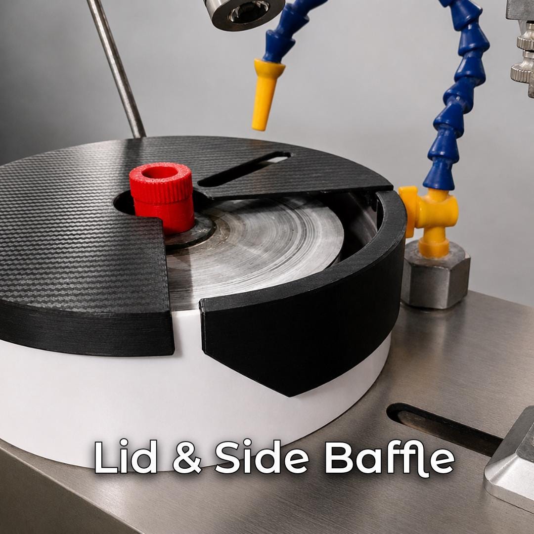 Black lap lid and side baffle installed over the spinning lap on a VEVOR faceting machine with water nozzle and red thumb screw. Splash control accessory for lapidary faceting, gemstone cutting, water management, and cleaner polishing.
