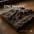 CNC service for wood and composites shown with a detailed hardwood mountain relief carving, representing custom woodworking, 3D relief carving, bespoke craftsmanship, exotic wood projects, carbon fiber, epoxy resin, and made-to-order machining by Aetherium Innovations.
