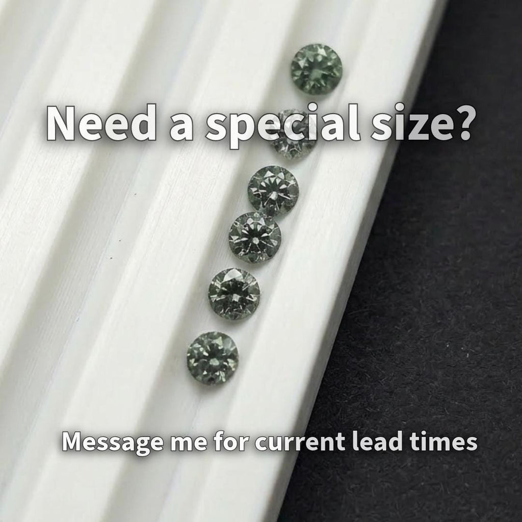 Close-up image of 2 mm lab-grown green tourmaline stones with one held in tweezers next to a fingertip for scale. The gemstones display deep green color, consistent round cuts, and clean facets. This image highlights size accuracy and suitability for precision jewelry work including halo settings, side stones, and detailed micro placement.