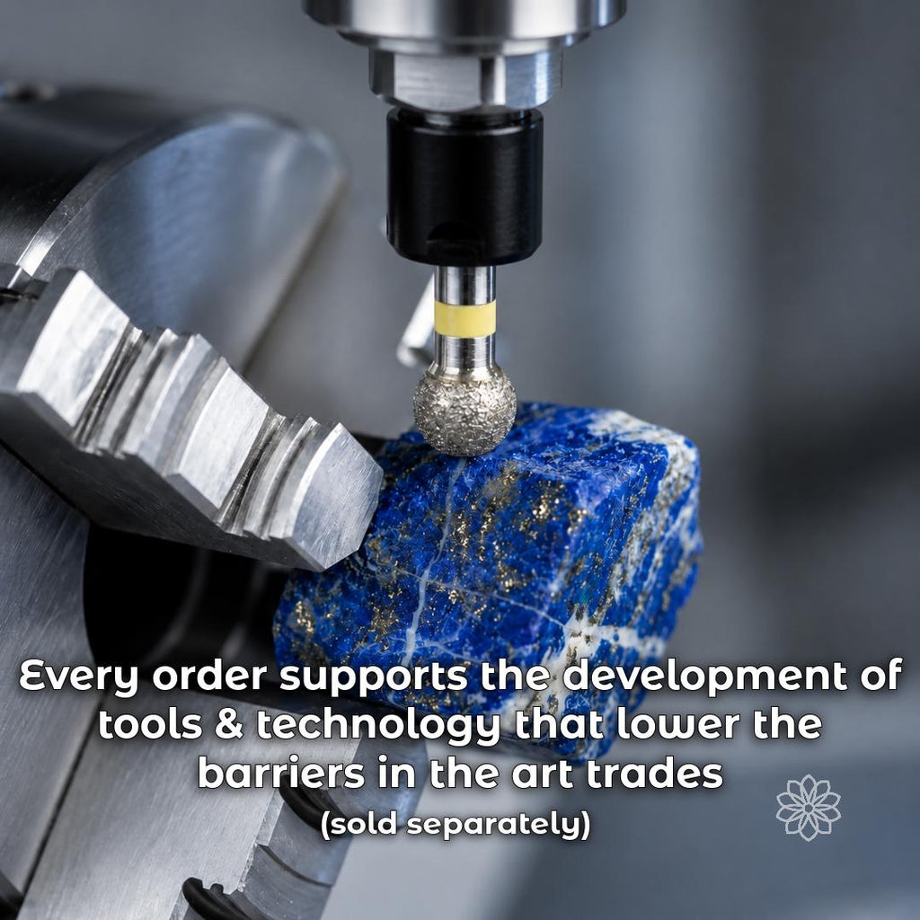 Sintered diamond ball bur machining rough lapis lazuli held in a CNC rotary chuck. Complementary gemstone carving tool for lapidary work, stone shaping, jewelry making, CNC machining, and pre-polish surface preparation.