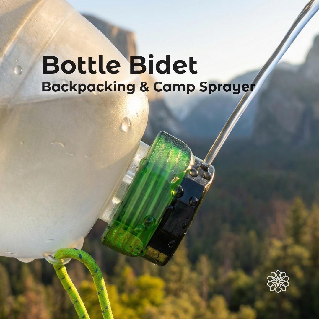 Ultralight backcountry bidet cap attached to a water bottle, creating a controlled rinse stream for backpacking hygiene and camp use. Bottle rinse nozzle designed for water bottle (Smartwater) compatibility, portable outdoor bidet tool used in mountain environment for cleaning and water control.
