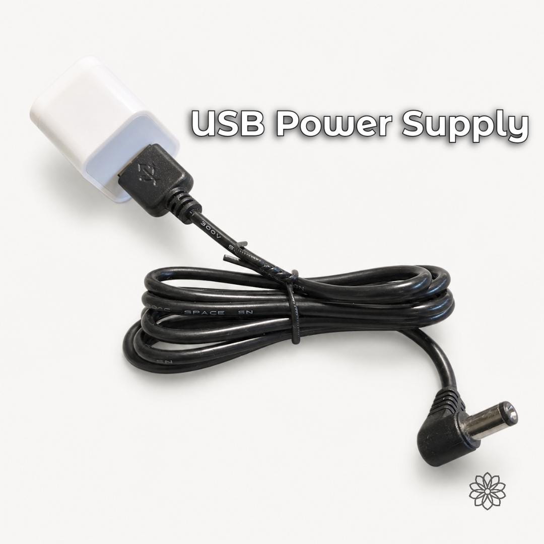 USB power supply cable for the digital angle finder, shown coiled on a white background with USB connector and barrel plug for powering the faceting mast display.