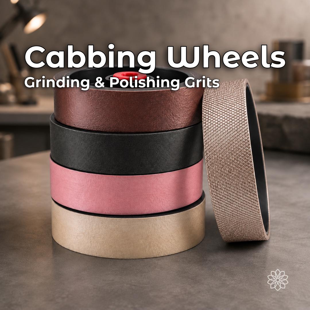 Stack of 6-inch lapidary cabbing wheels on a workshop bench, including soft resin-backed diamond polishing wheels and a hard electroplated diamond grinding wheel. Available as individual replacement wheels for shaping, sanding, pre-polishing, and polishing cabochons.