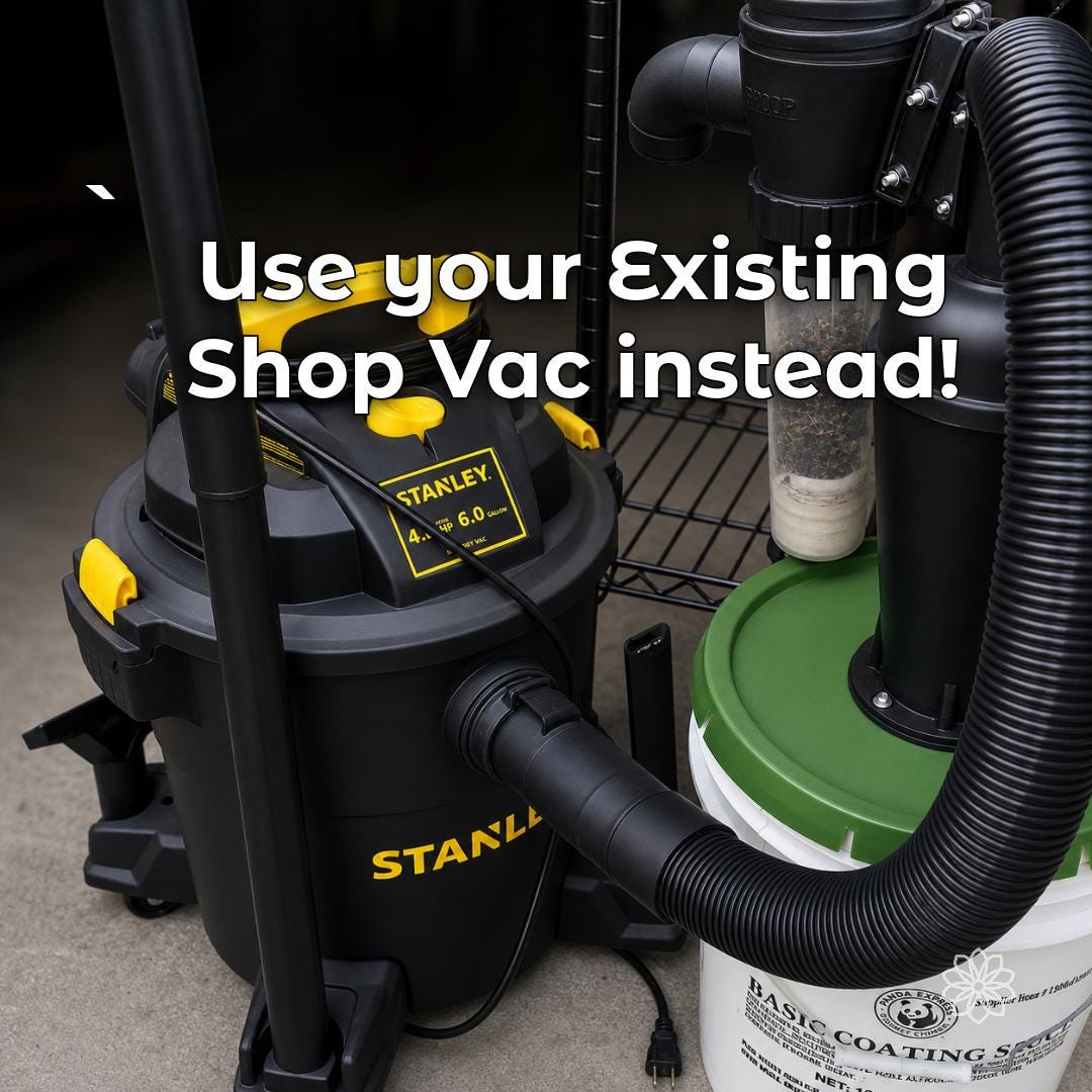 Black and yellow Stanley 6-gallon shop vacuum connected by corrugated hose to a cyclone separator, presented as external chip and dust-collection equipment for desktop CNC work.