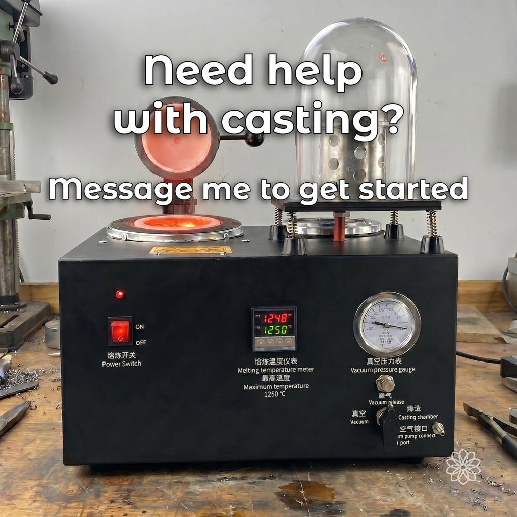 Bench-top vacuum casting machine with heated crucible, chamber, temperature controls, and message about casting assistance