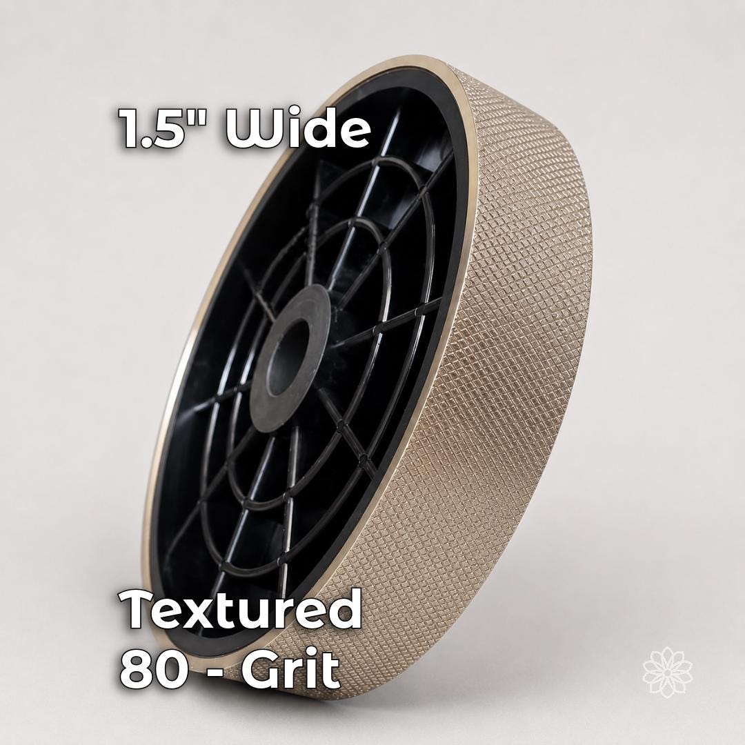 Six-inch by 1.5-inch textured electroplated diamond lapidary grinding wheel in coarse 80 grit, shown with a rigid black hub and crosshatched abrasive surface for rapid stock removal, rough shaping, and cabochon preforming.