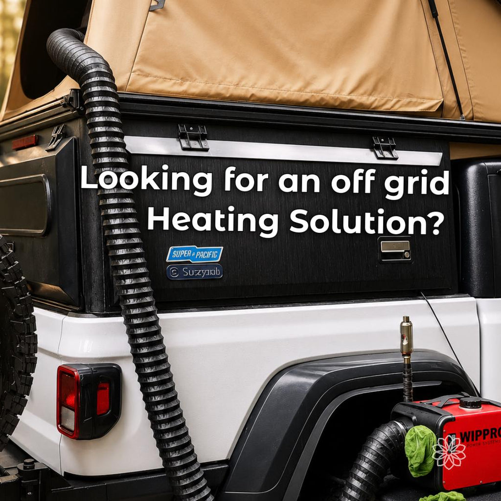 Portable diesel heater beside an overland vehicle with rooftop tent, with black flexible warm-air duct routed from the heater up into the tent for off-grid cold-weather camping and shelter heating.