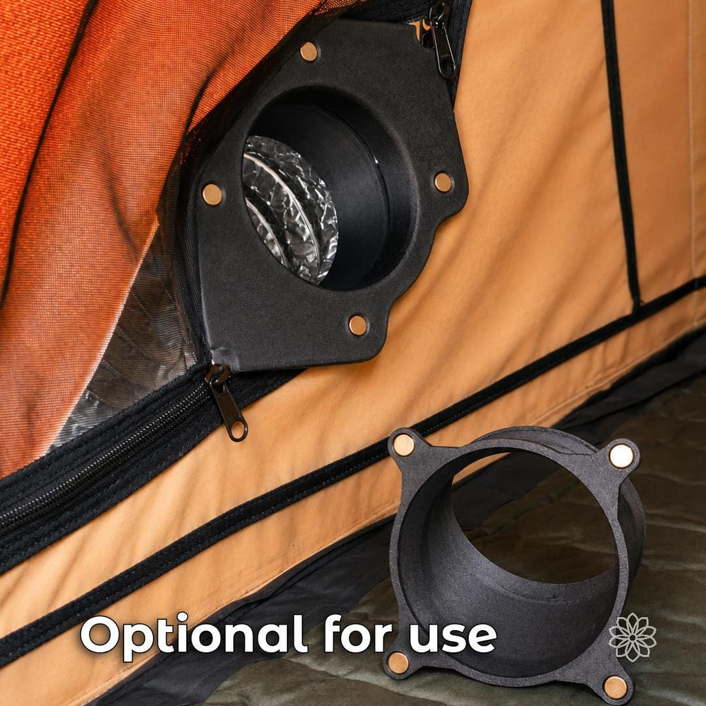 Interior view of a rooftop tent with the Tent Link main housing installed at a zipper opening and the optional 45-degree magnetic adapter shown detached in the foreground for directional warm-air routing.