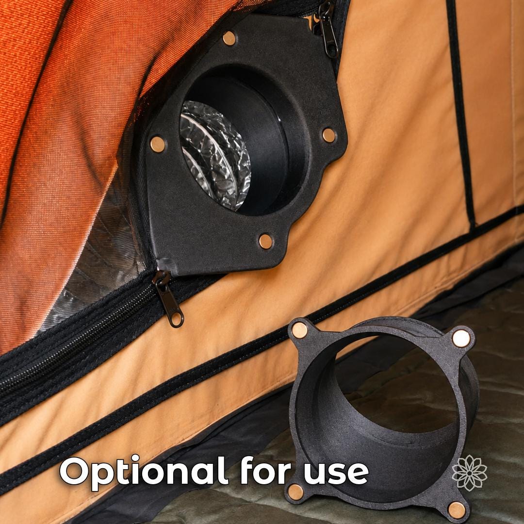 Interior view of a rooftop tent with the Tent Link main housing installed at a zipper opening and the optional 45-degree magnetic adapter shown detached in the foreground for directional warm-air routing.