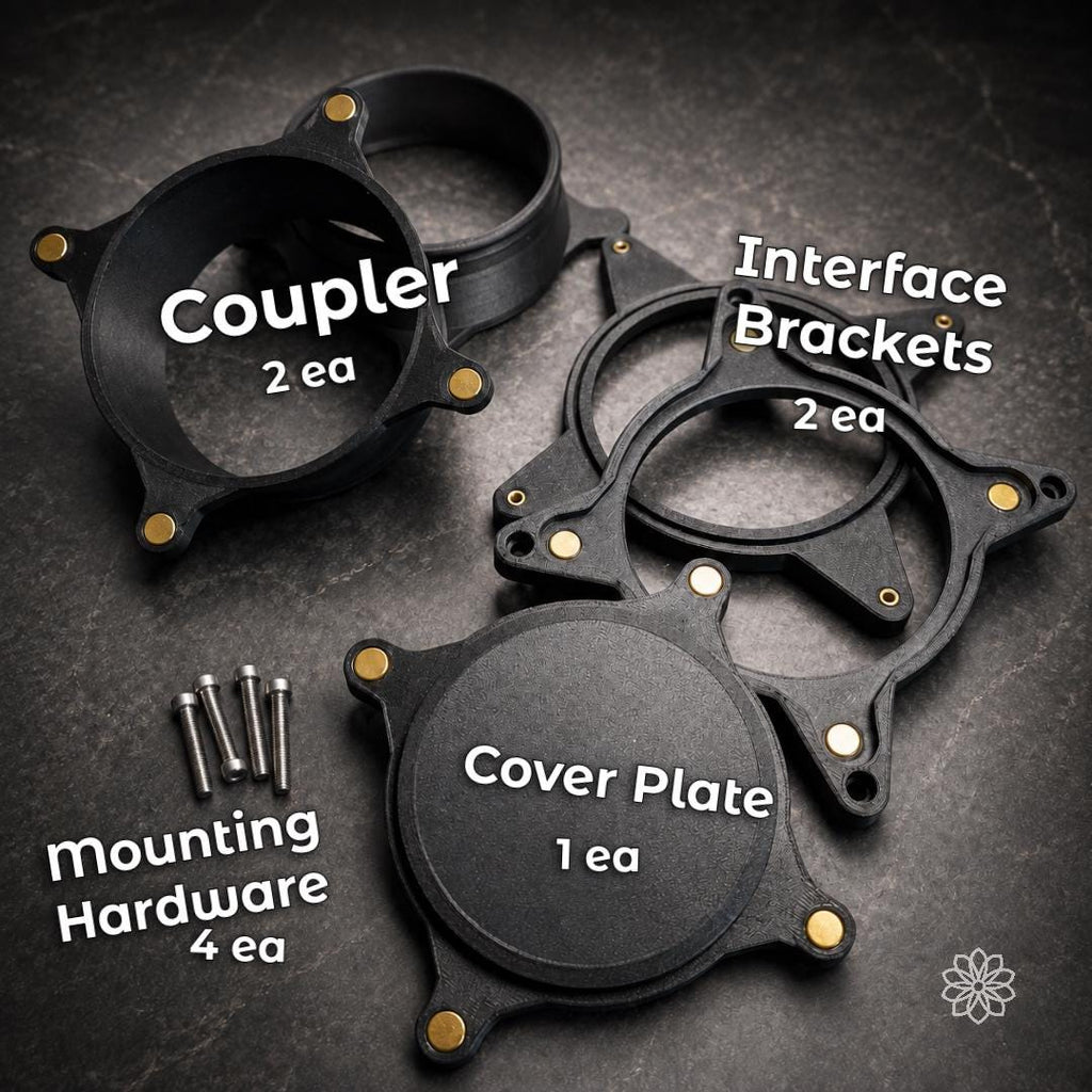 Complete Vent Link heater pass-through kit with two magnetic hose couplers, two structural interface brackets, removable cover plate, and four mounting bolts arranged on a workshop surface.
