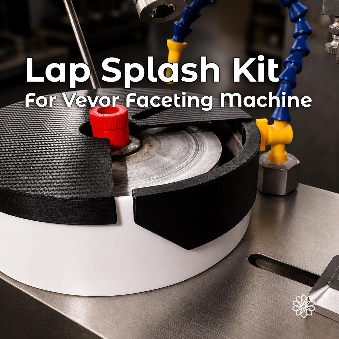 VEVOR faceting machine fitted with the Aetherium Lap Splash Kit, including the black lap bowl lid and removable side baffle around the 6-inch lap. The two-piece system helps contain water, cutting slurry, and grinding debris around the bowl while preserving access to the working area.