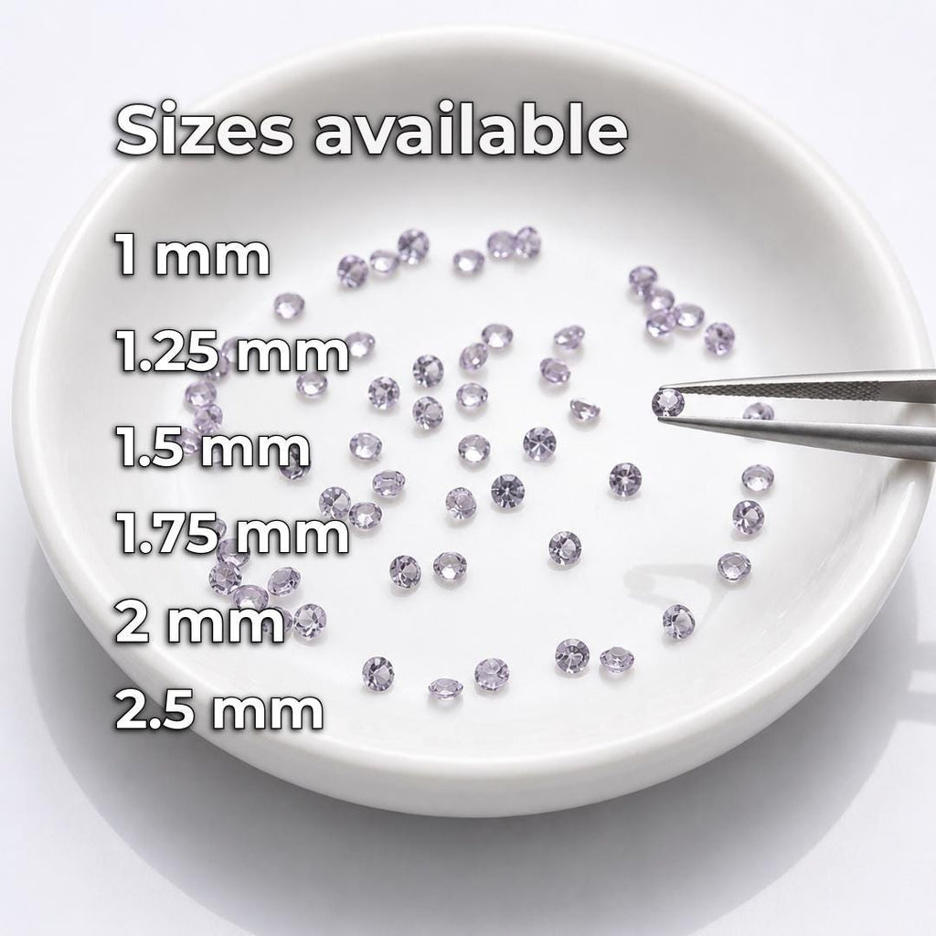Calibrated round lab-grown alexandrite gemstones displayed in a white sorting dish with jeweler’s tweezers. Available diameters are shown as 1 mm, 1.25 mm, 1.5 mm, 1.75 mm, 2 mm and 2.5 mm, providing loose gemstone options for pavé, halo settings, jewelry repair, side stones and precision fabrication.