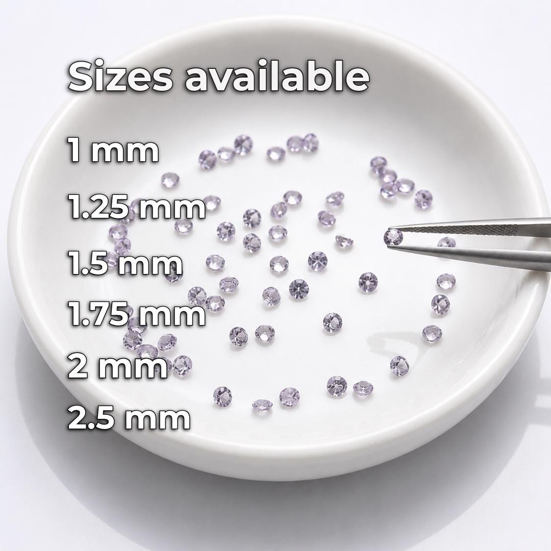Calibrated round lab-grown alexandrite gemstones displayed in a white sorting dish with jeweler’s tweezers. Available diameters are shown as 1 mm, 1.25 mm, 1.5 mm, 1.75 mm, 2 mm and 2.5 mm, providing loose gemstone options for pavé, halo settings, jewelry repair, side stones and precision fabrication.