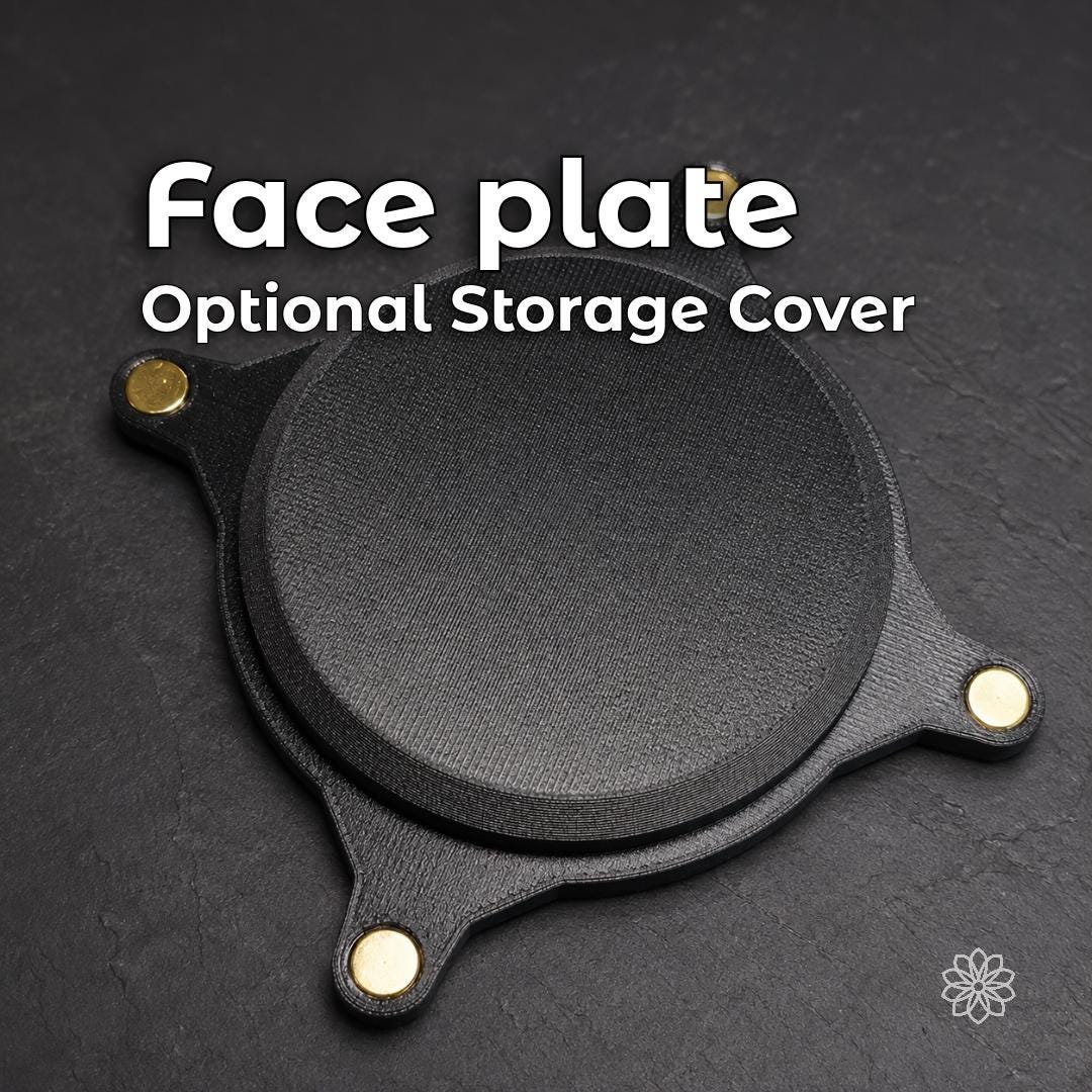 Black magnetic Vent Link face plate with embedded magnets, designed to cover the structural heater pass-through opening when the ducting is removed or stored.