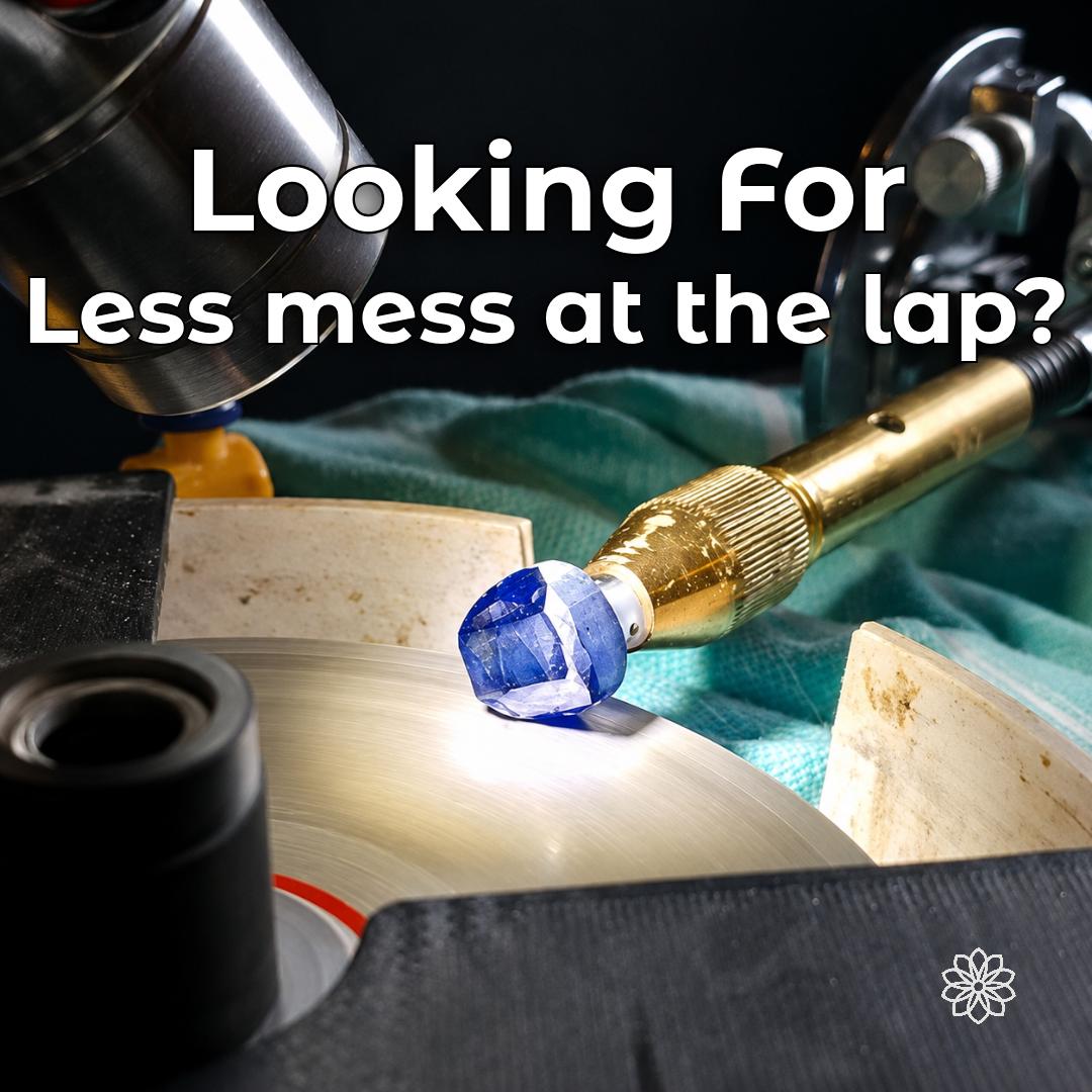 Gemstone being faceted on a wet VEVOR lap with the open bowl and surrounding work area visible. The image highlights the common problem of water and cutting slurry escaping the lap during faceting and creating additional mess around the machine and workbench.