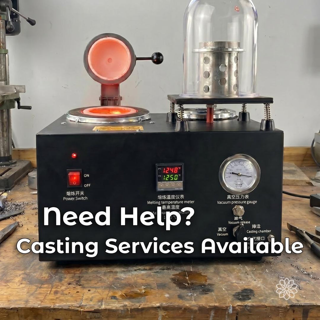 Jewelry vacuum casting machine with heated crucible and perforated casting flask in an active workshop. Aetherium casting services provide an option for makers who need help moving wax or jewelry models through the investment casting process.