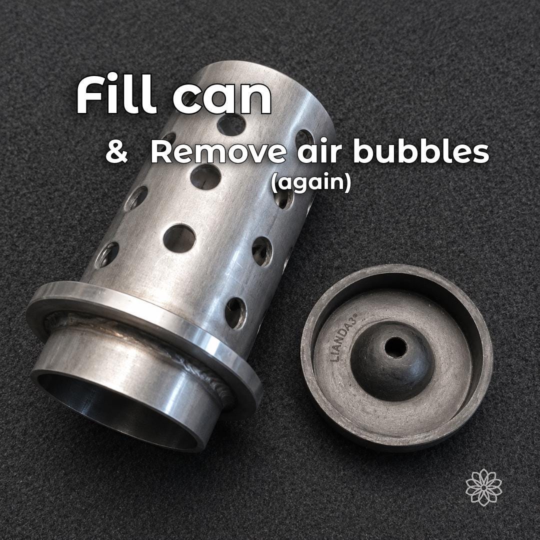 Perforated jewelry casting flask and vacuum base used after filling with investment. Vacuuming the filled flask helps release air bubbles trapped against wax or resin patterns, reducing surface defects, casting nodules, pitting, and loss of fine jewelry detail.