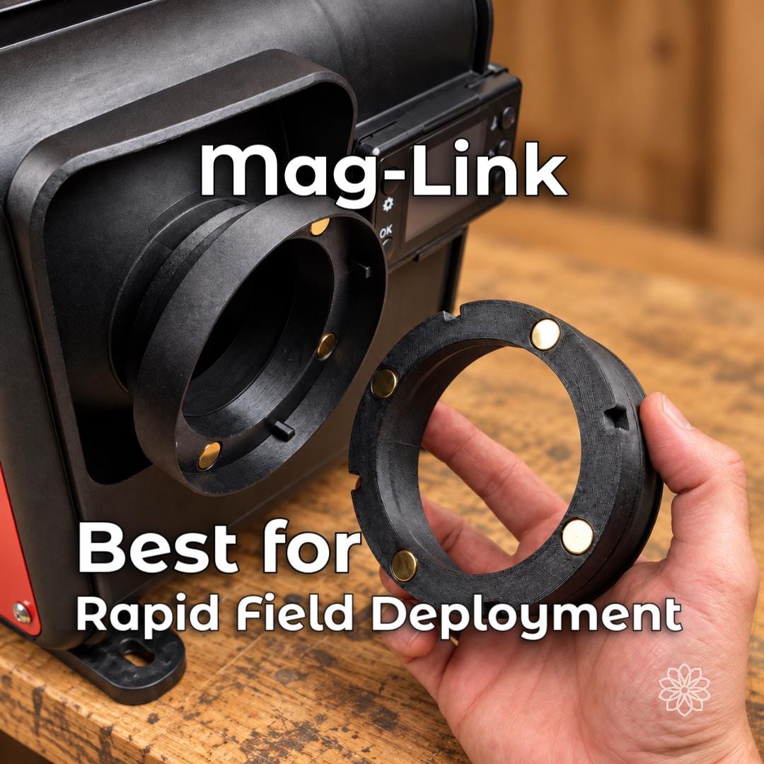 Aetherium Mag-Link magnetic diesel heater coupler shown separated from its heater-mounted collar, exposing the embedded magnets used for rapid connection and disconnection of portable hot-air ducting in field setups.