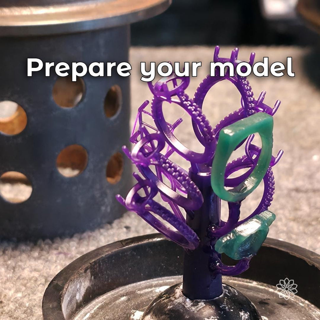 Wax and resin jewelry ring models arranged on a sprue tree before investment casting. Multiple ring settings and detailed jewelry patterns demonstrate model preparation for lost wax casting and small-batch jewelry production.