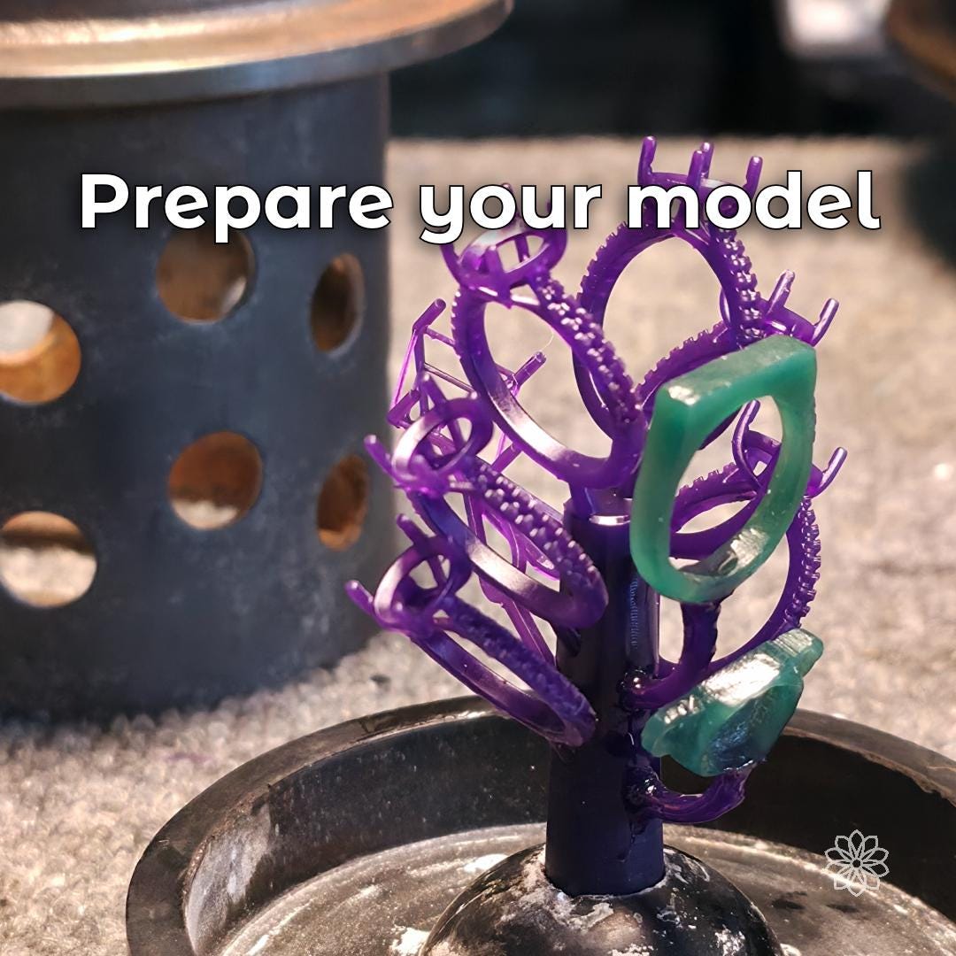 Wax and resin jewelry ring models arranged on a sprue tree before investment casting. Multiple ring settings and detailed jewelry patterns demonstrate model preparation for lost wax casting and small-batch jewelry production.