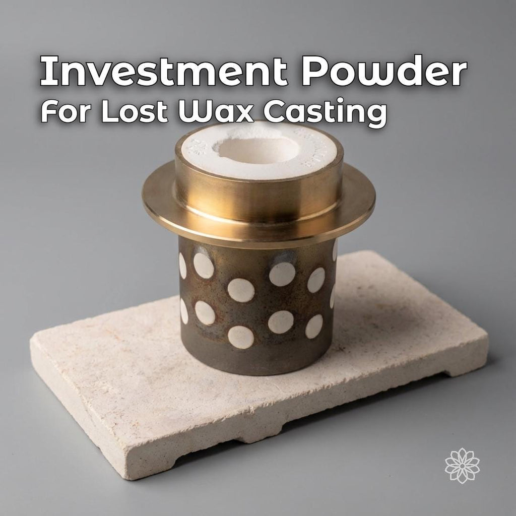 Jewelry investment powder for lost wax casting shown in a perforated casting flask on a heat-resistant block. Investment surrounds the mold cavity inside the flask, illustrating its use for precision jewelry casting, rings, pendants, and small metal components.