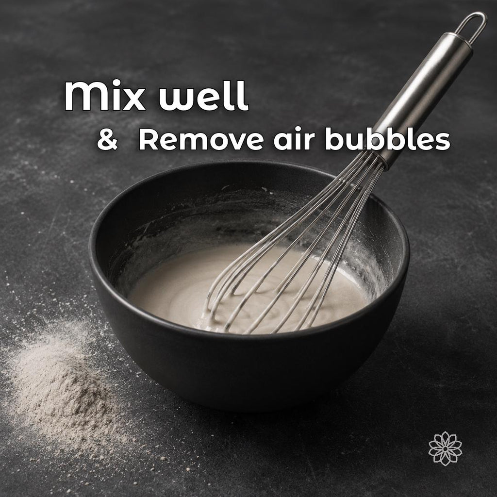 Jewelry investment powder being mixed for lost wax casting, with emphasis on reducing trapped air bubbles before pouring. Thorough mixing and proper vacuuming help prevent casting defects such as metal nodules, rough surface texture, and poor detail in finished rings and jewelry.