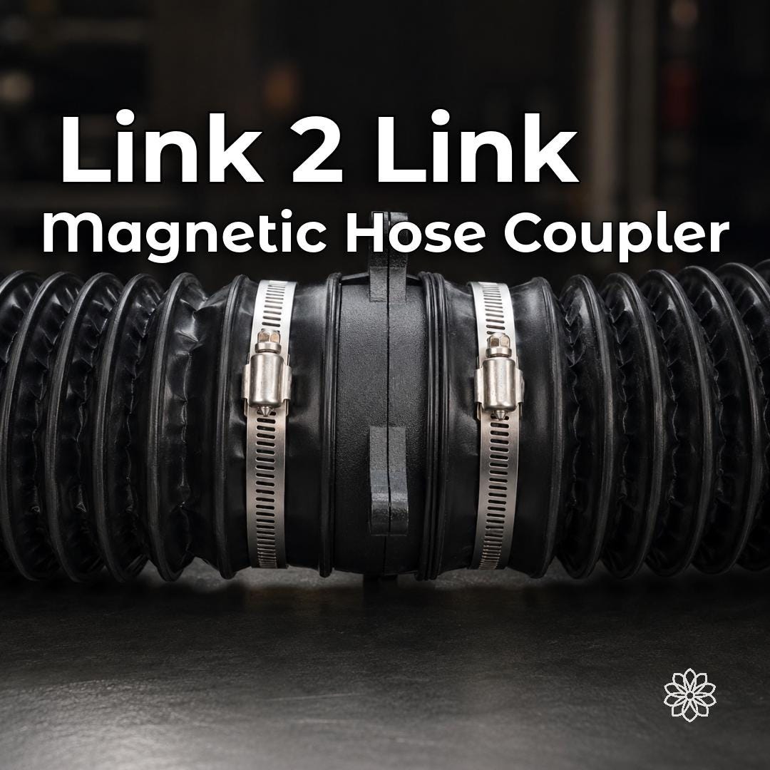 Aetherium Link 2 Link magnetic diesel heater hose coupler joining two flexible heater duct sections with hose clamps on a workshop bench.