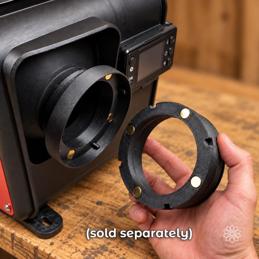 Hand holding a magnetic Aetherium Mag Link heater adapter beside the matching outlet on a portable diesel heater, showing the removable magnetic connection interface.