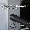 Makera Carvera Air shop-vac adapter with black 3D-printed construction, installed between the desktop CNC machine's rear dust port and a vacuum hose for external chip and dust collection.