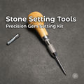 Wooden-handled stone setting tool with knurled chuck, pointed setting tip, and loose adapter collet on a white work surface